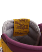 Nike Air Jordan 1 Retro High Top Sneakers in University Gold Light Bordeaux Leather