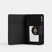 Coach Outlet Medium Corner Zip Wallet In Signature Canvas
