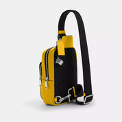 Coach Outlet Racer Sling Pack In Signature Canvas With Charms