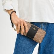 Coach Outlet Long Zip Around Wallet In Signature Canvas With Stripe
