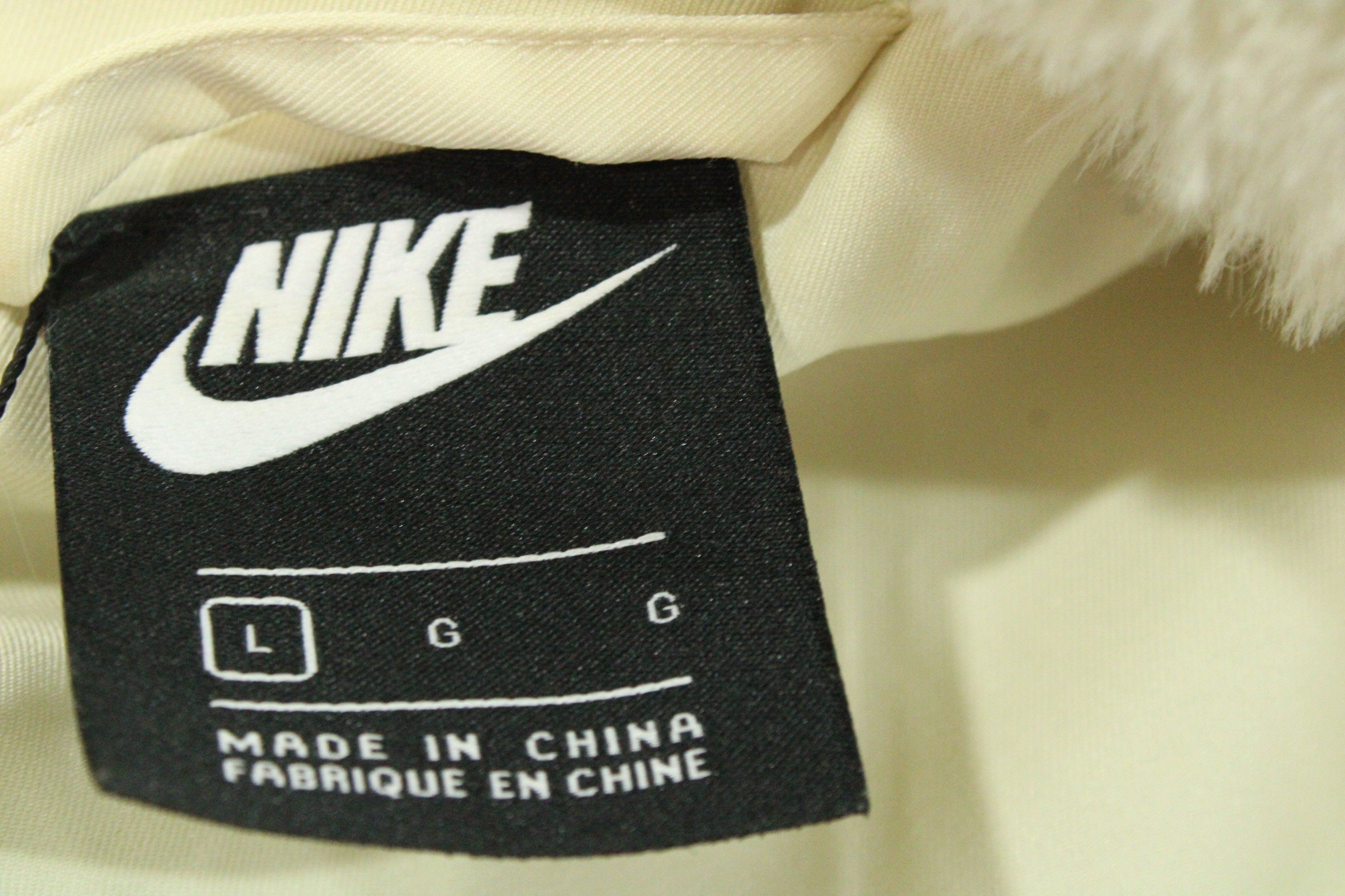 Nike Big Swoosh Jacket in Cream Faux Fur
