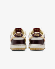 Women's Dunk Low Lx Year Of The Snake Shoes In Sail/burgundy Crush/team Gold
