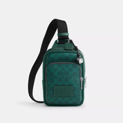 Coach Outlet Racer Sling Pack In Signature Canvas With Charms