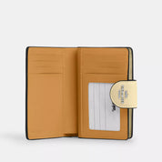 Coach Outlet Medium Corner Zip Wallet In Signature Canvas