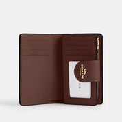 Coach Outlet Medium Corner Zip Wallet In Signature Canvas