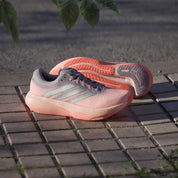 Women's Supernova Rise 3 Running Shoe - Clear Orange/Silver Metallic/Glory Grey - Regular (B)